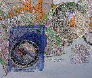 [Orienteering map, compass, and a control bag.]